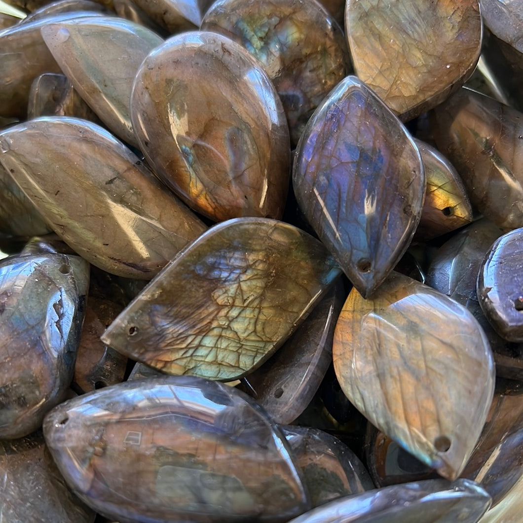 Drilled labradorite cabochons